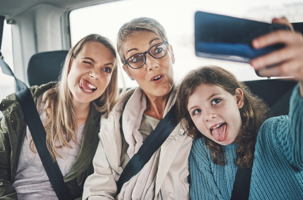 phone-selfie-family-car-with-silly-faces-driving-holiday-destination-together-grandmother-mother-girl-child-taking-picture-smartphone-route-vacation-resort-quickcab